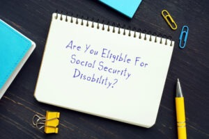 Are You Eligible For Social Security Disability? with sign on the piece of paper
